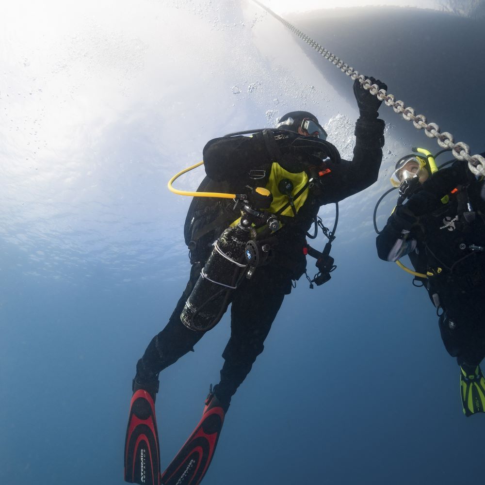 Beginner scuba class practicing in a pool