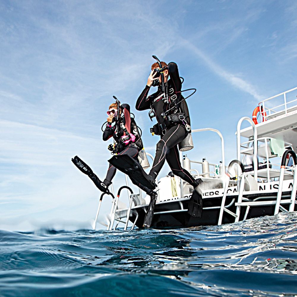 Beginner scuba diver floating comfortably underwater