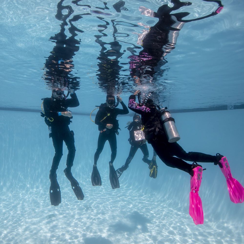 Michigan divers practicing in a quarry or lake